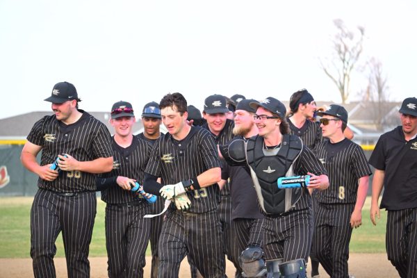 The Red Devils celebrating their win after freshman Andrew Zimmerman walks it off.